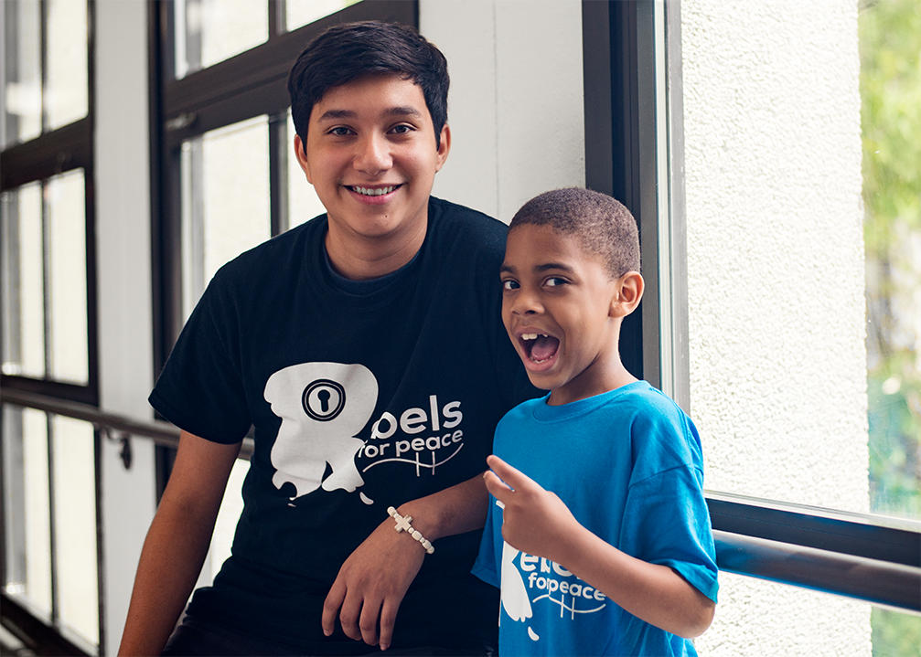 Group marching and man wearing shirt that says I'm part of the solution