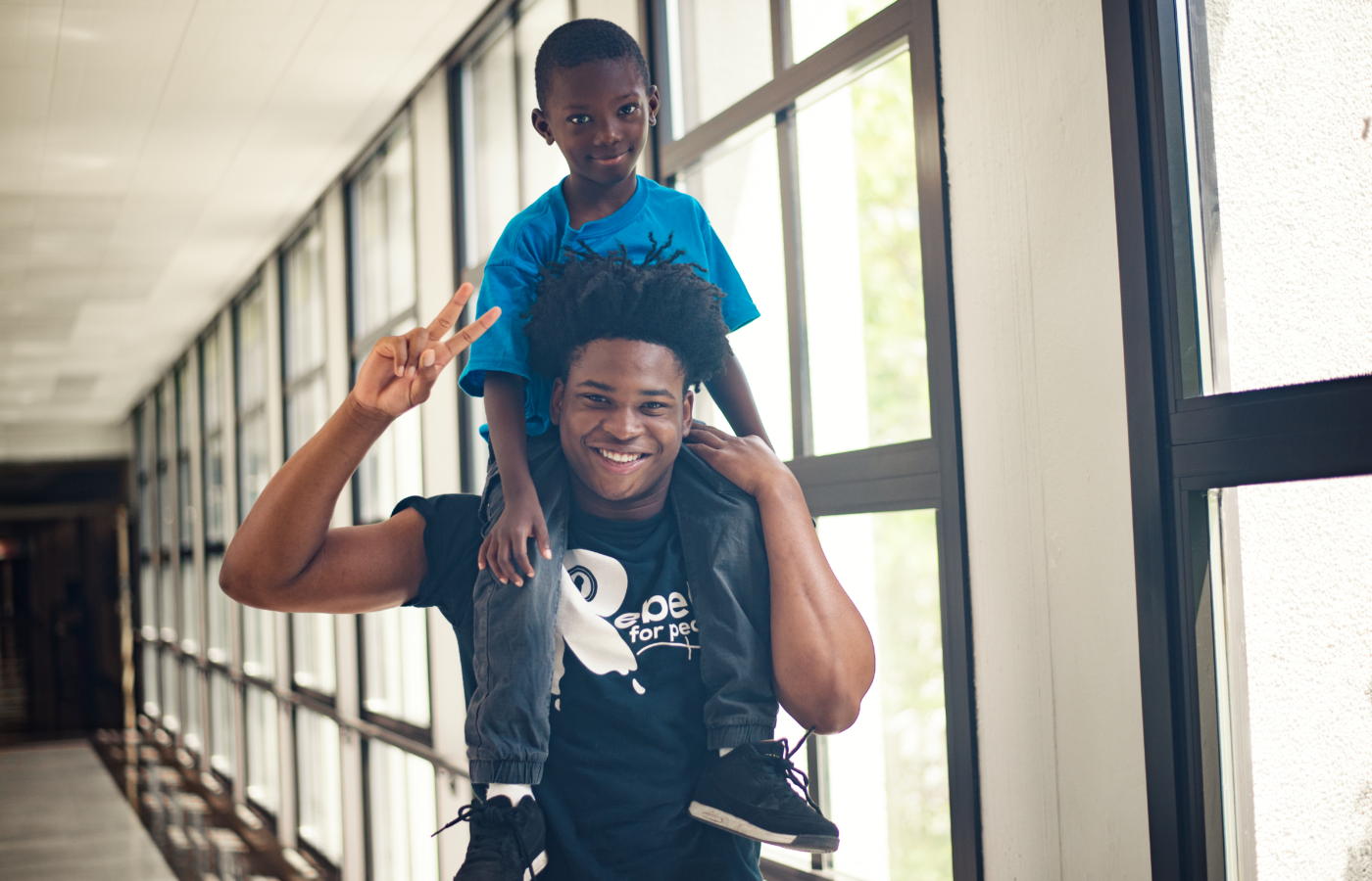 Group marching and man wearing shirt that says I'm part of the solution