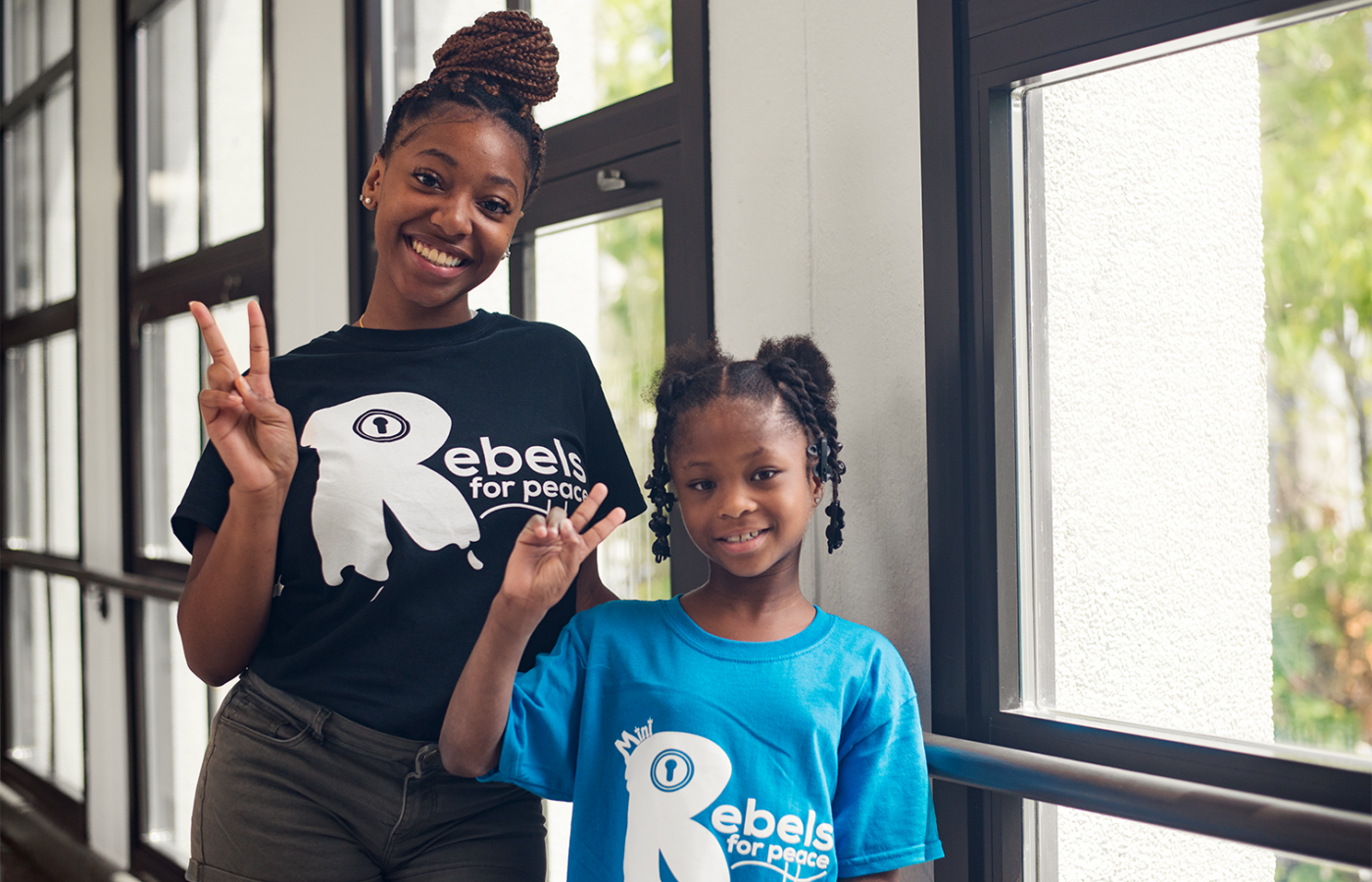 Group marching and man wearing shirt that says I'm part of the solution
